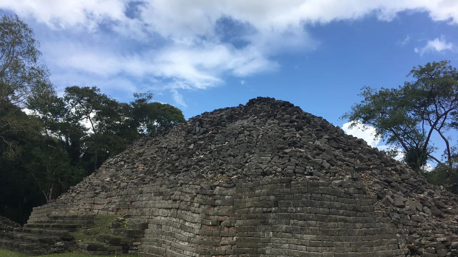 Dry-laid limestone terraces and rounded building corners at the Maya site of Lubaantun in Toledo District, southern Belize